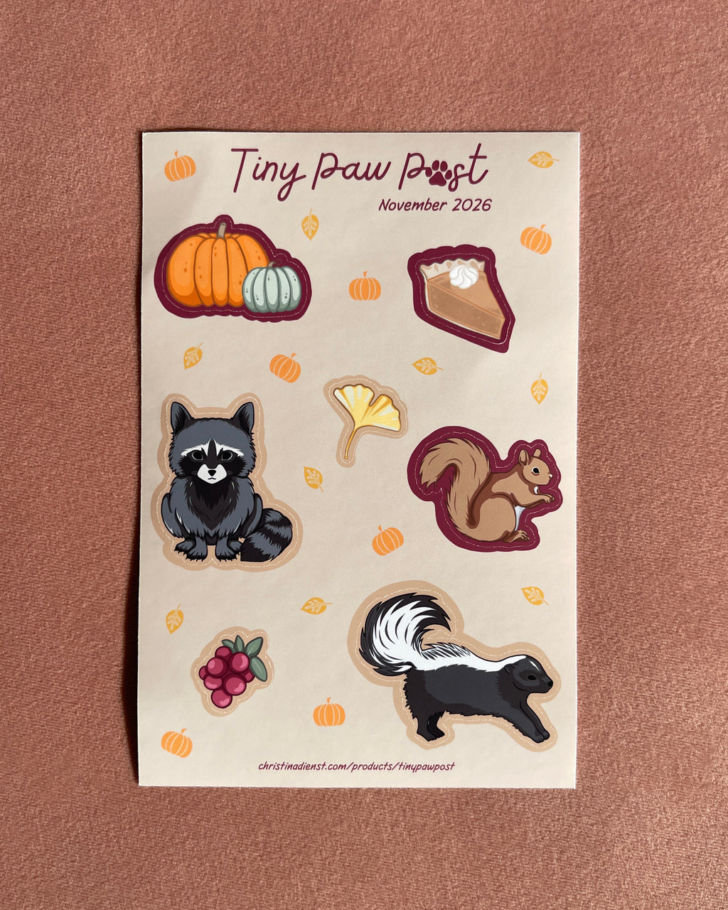 a tan sticker sheet with cute animal illustrations on blush velvet 