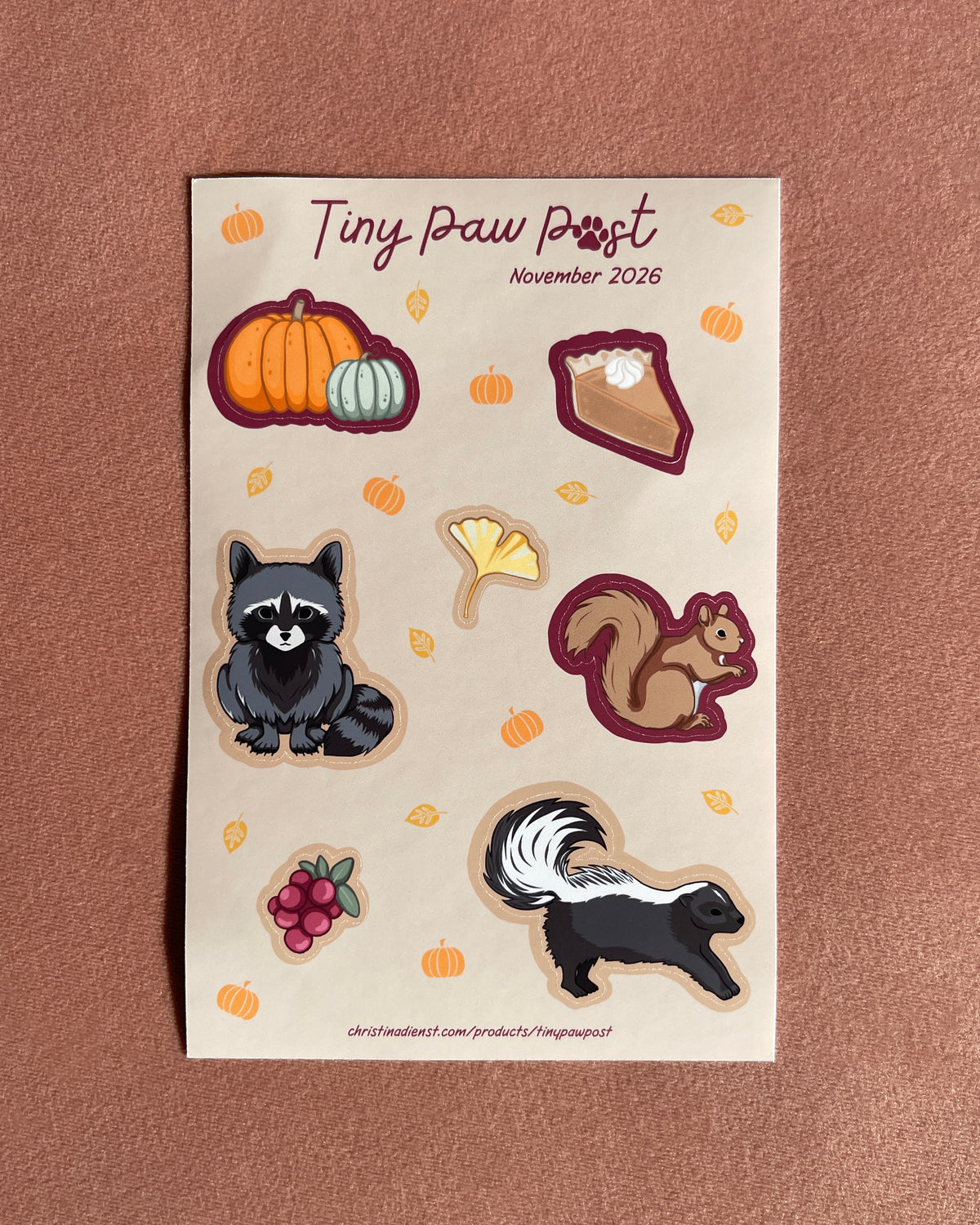 a tan sticker sheet with cute animal illustrations on blush velvet 