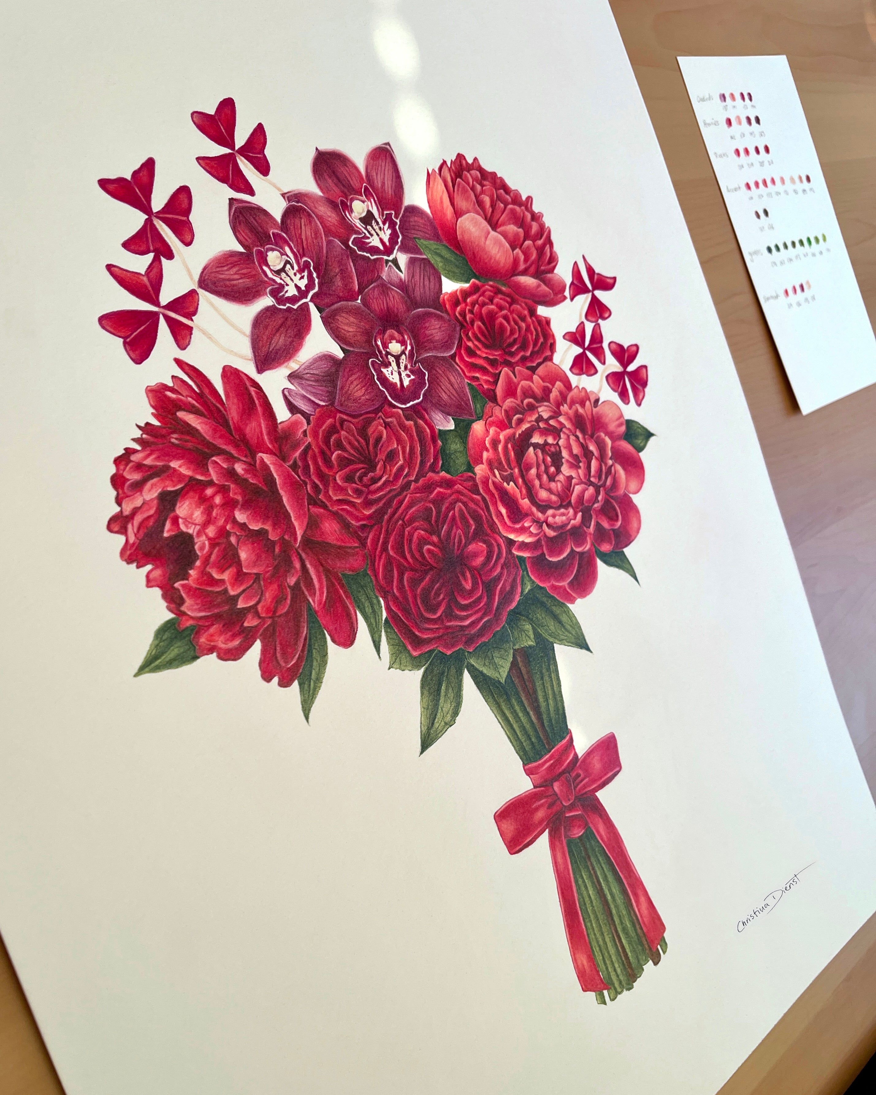 Bouquet of red flowers with a bow on a white background