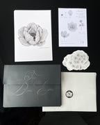 Floral-themed print club set including an anemone art print, sticker and a black envelope.