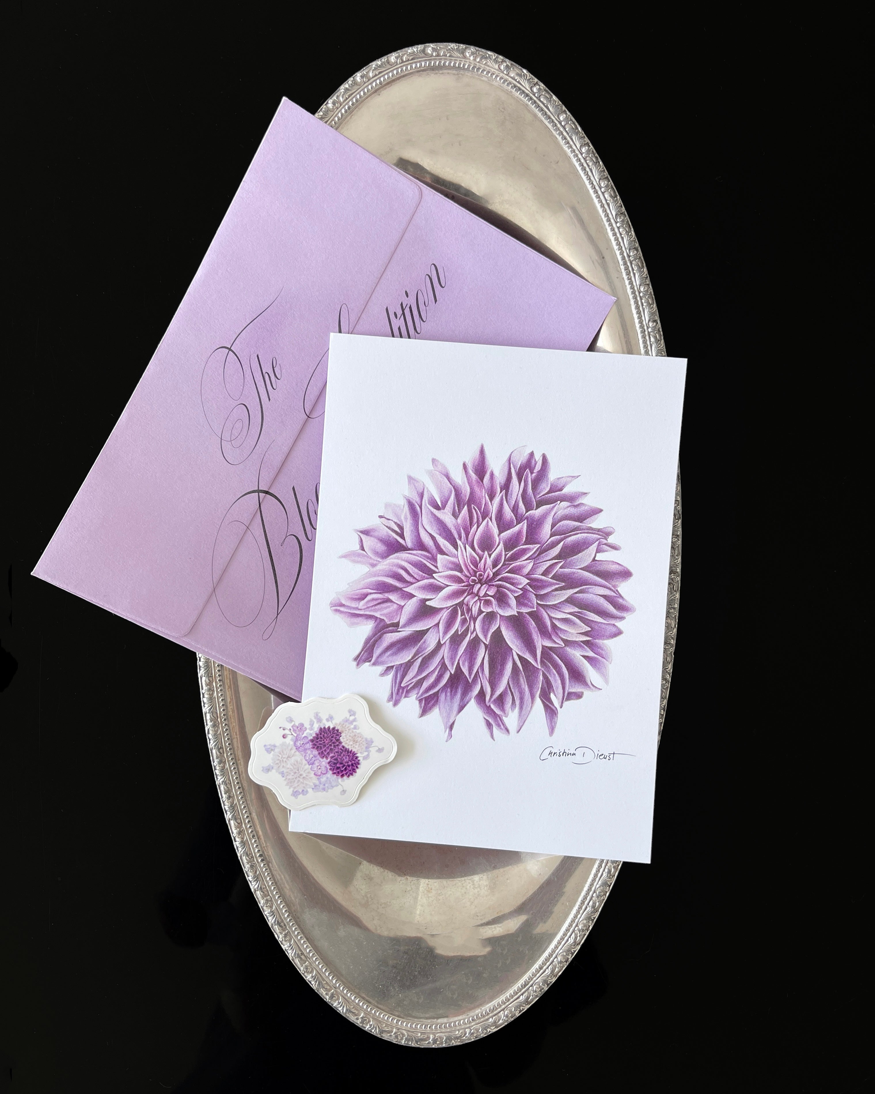Floral-themed print club set including a dahlia art print, sticker and a light purple envelope.